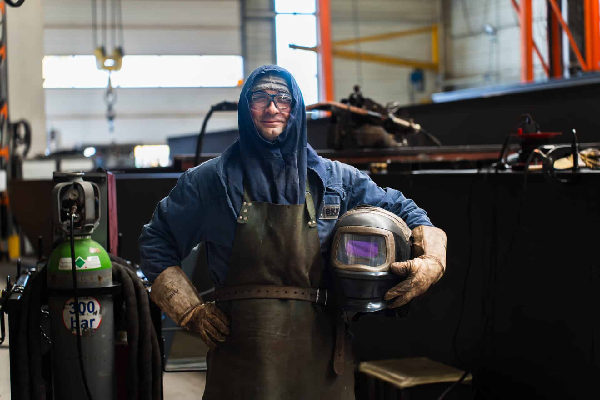 Lachende Lasser / constructiebankwerker